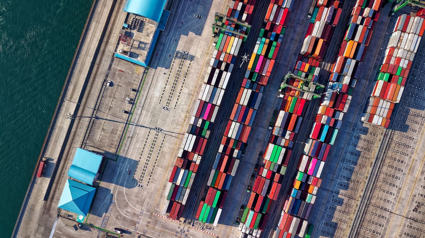 Aerial view of stacked shipping containers at a port